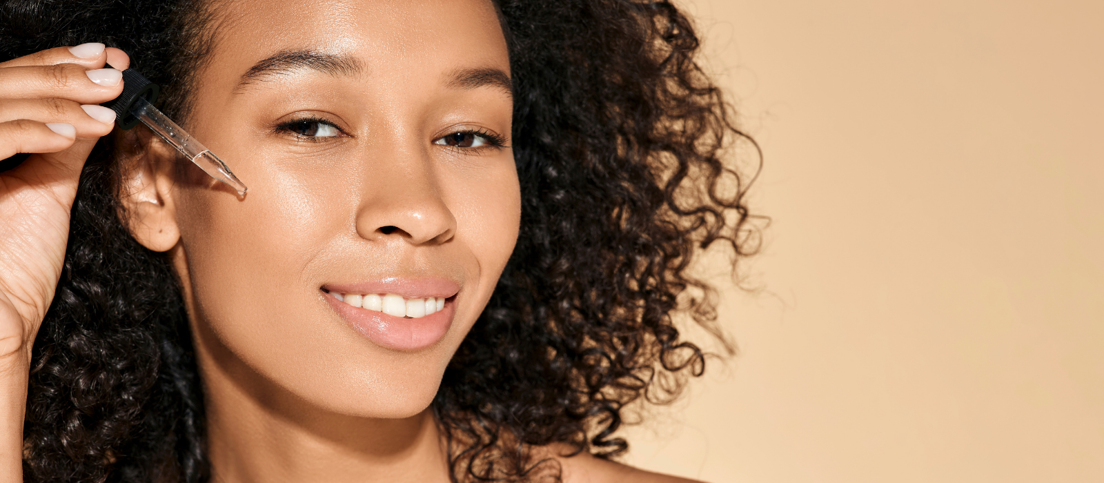 Skincare serums and oils on a clean surface