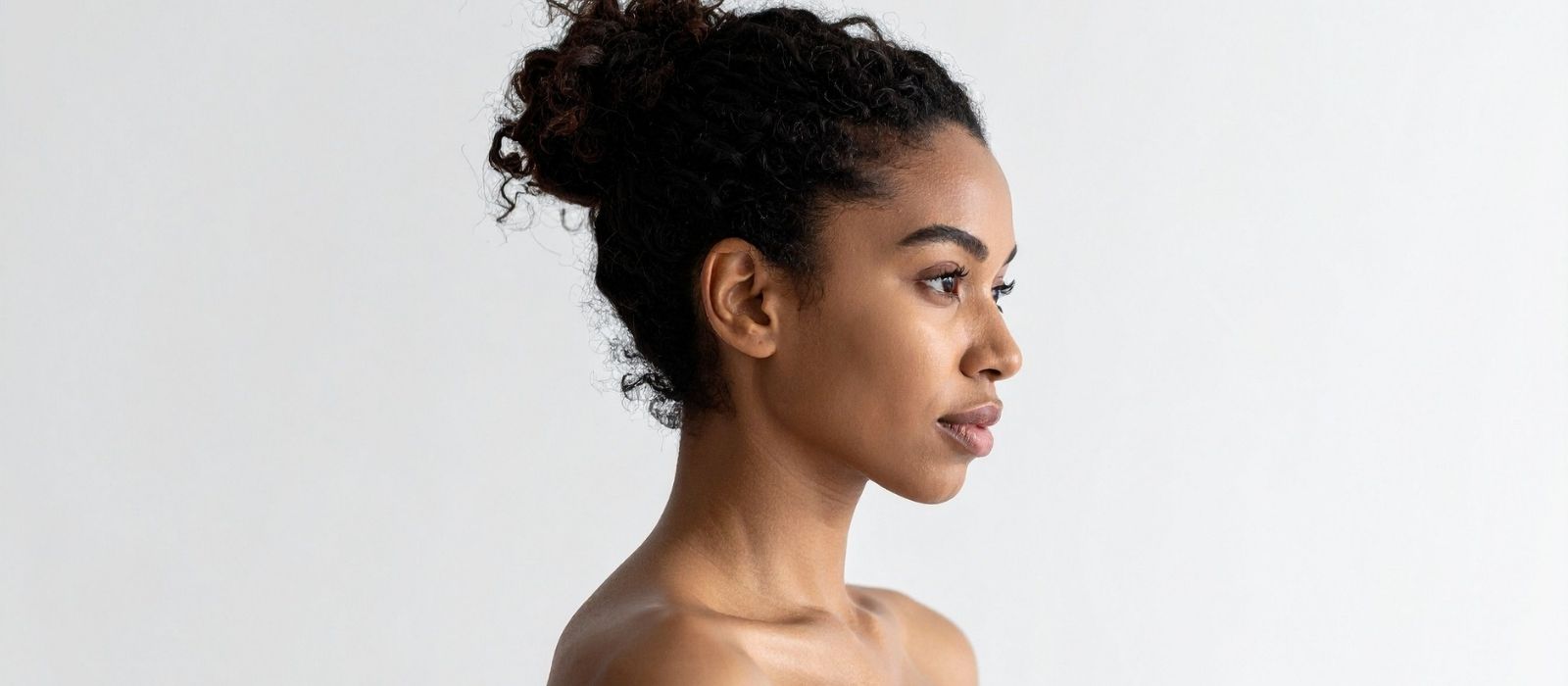 woman natural hair close up warm light natural