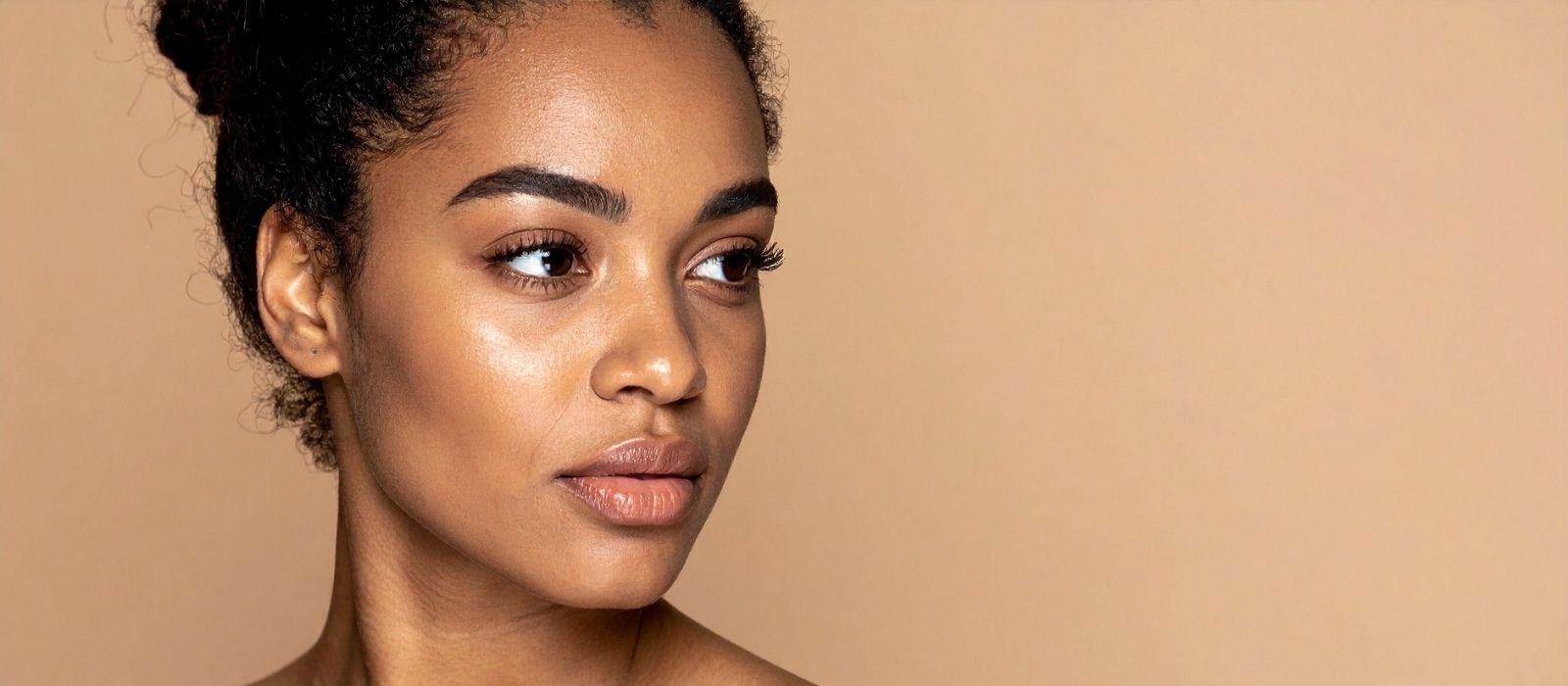 Close up of calm glowing skin in warm light