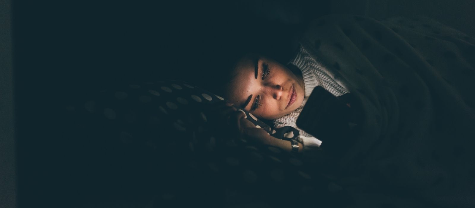 woman sleepless night calm bedroom warm light