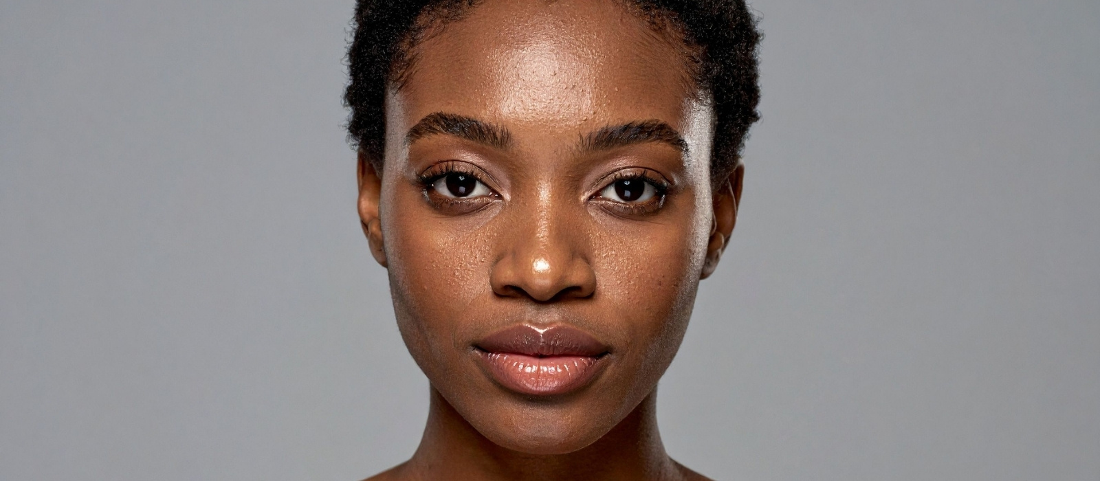 Close up of calm glowing skin in warm light