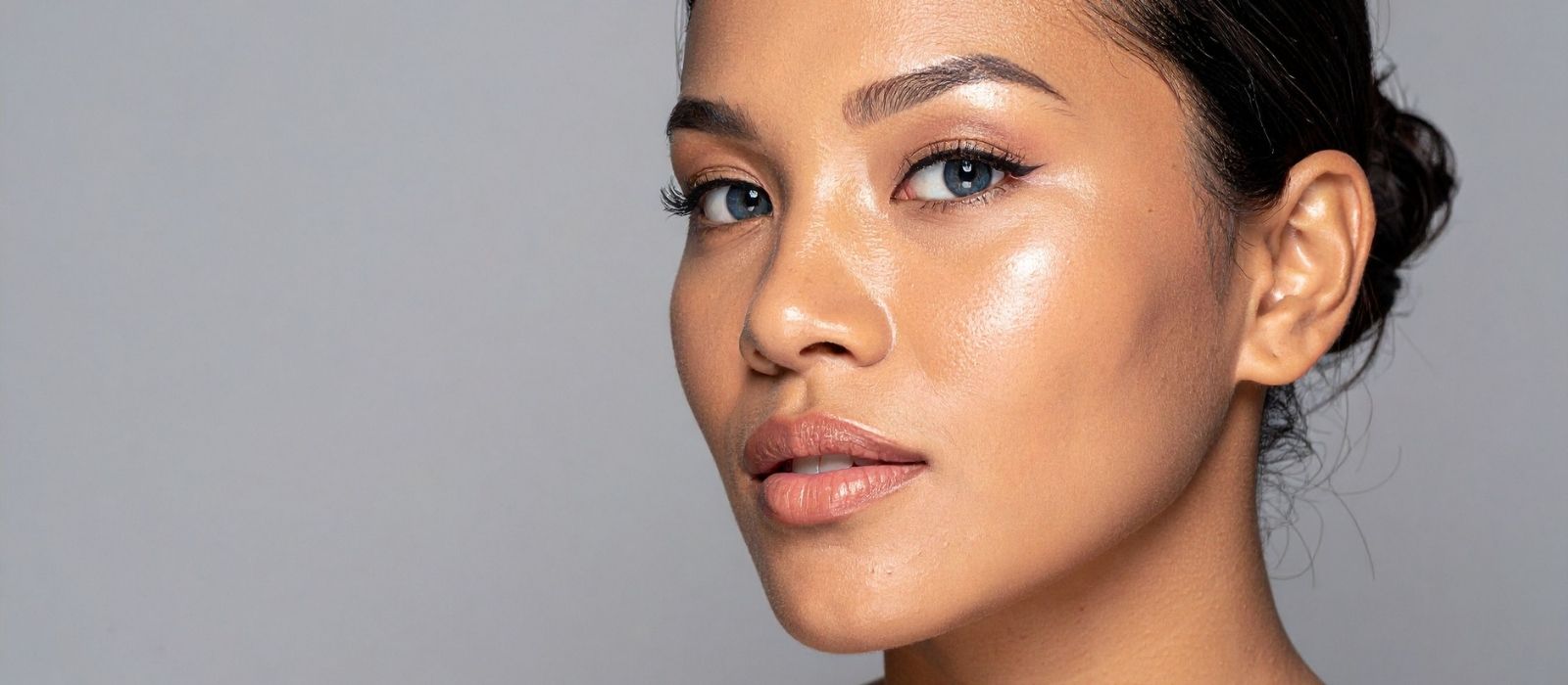 Woman with glowing skin in warm natural light