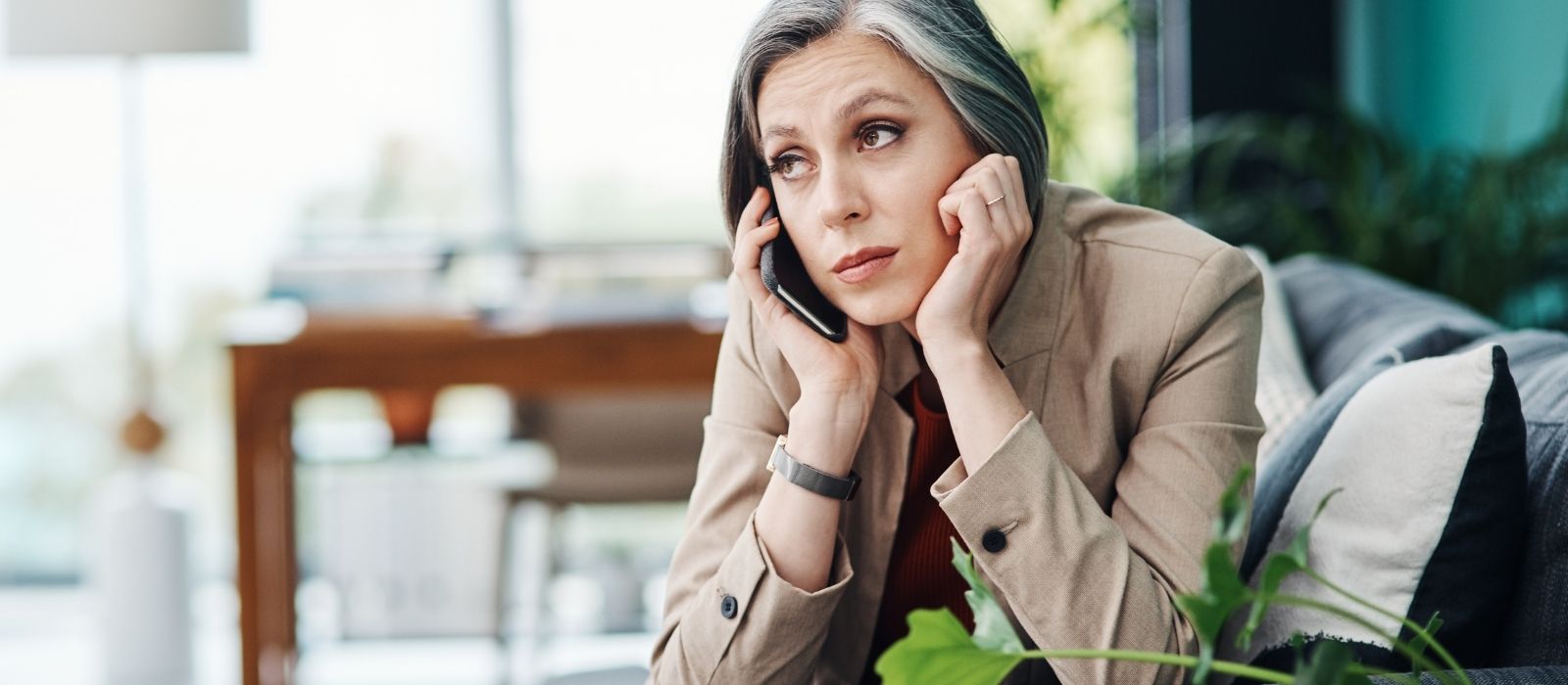 woman quiet reflection warm natural light interior