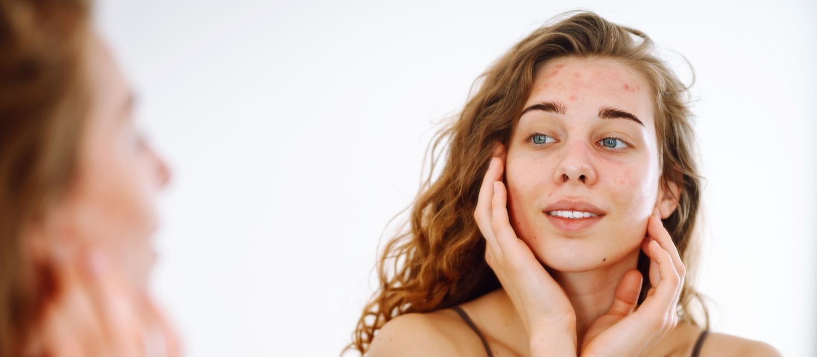 Woman with glowing skin in warm natural light