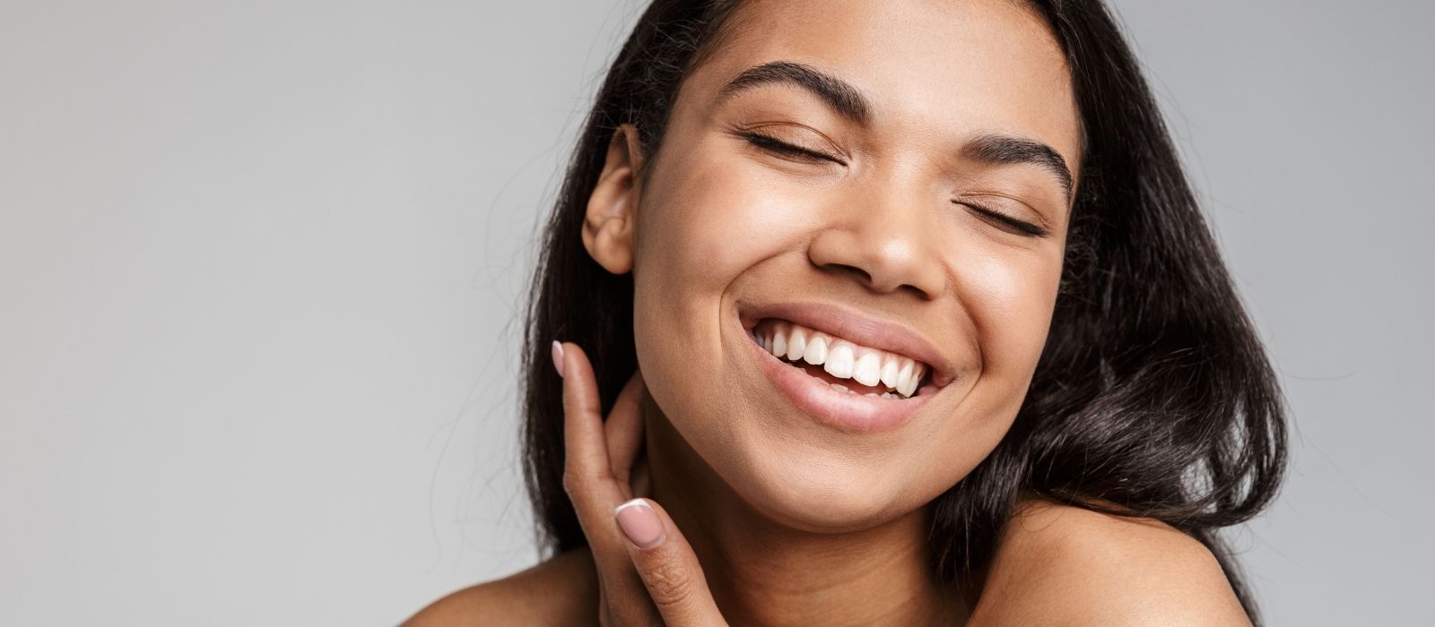 Woman with glowing skin in warm natural light