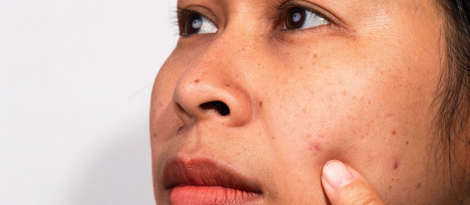 dark skin woman skincare glow even tone