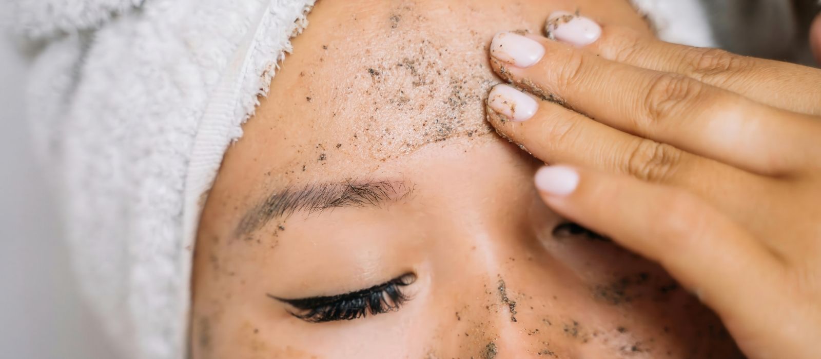 Skincare products and ingredients on a marble surface